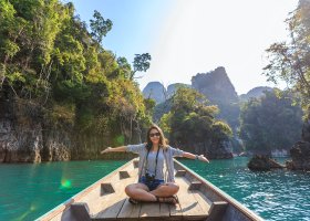 Person sitting zen-like on a dock